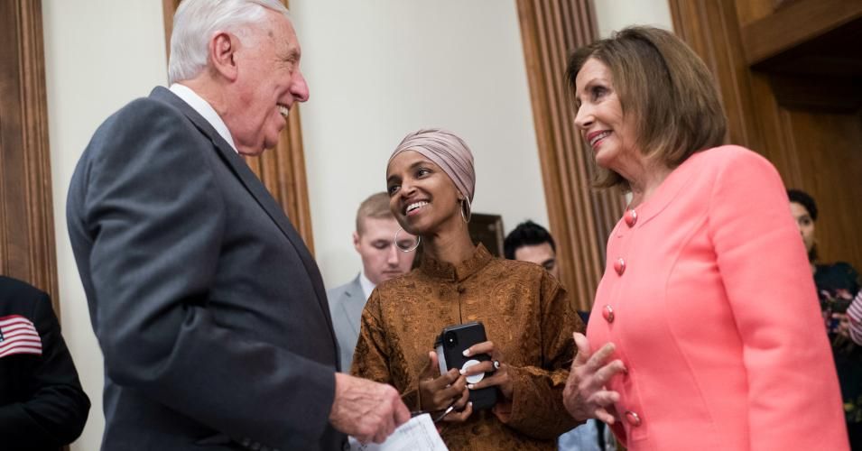 From left, House Majority Leader Steny Hoyer, D-Md., Ilhan Omar, D-Minn., and Speaker Nancy Pelosi, D-Calif., gather in the Capitol before a rally with House Democrats on their first 200 days of the 116th Congress on Thursday, July 25, 2019. (Photo By Tom Williams/CQ Roll Call)