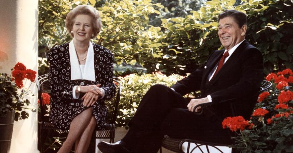 Former U.S. President Ronald Reagan and former British Prime Minister Margaret Thatcher sit on the patio outside the Oval Office on July 17, 1987 in Washington, D.C. (Photo: Mike Sargent/AFP via Getty Images)