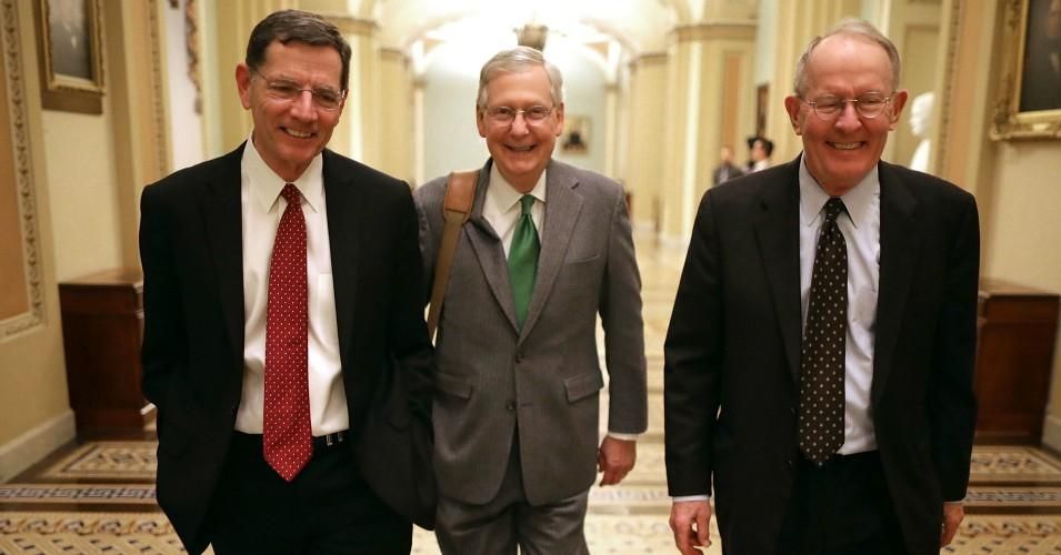 Sen. John Barrasso (R-Wyo.), Senate Majority Leader Mitch McConnell (R-Ky.), and Sen. Lamar Alexander (R-Tenn.) walk though the U.S. Capitol on February 8, 2017 in Washington, D.C.