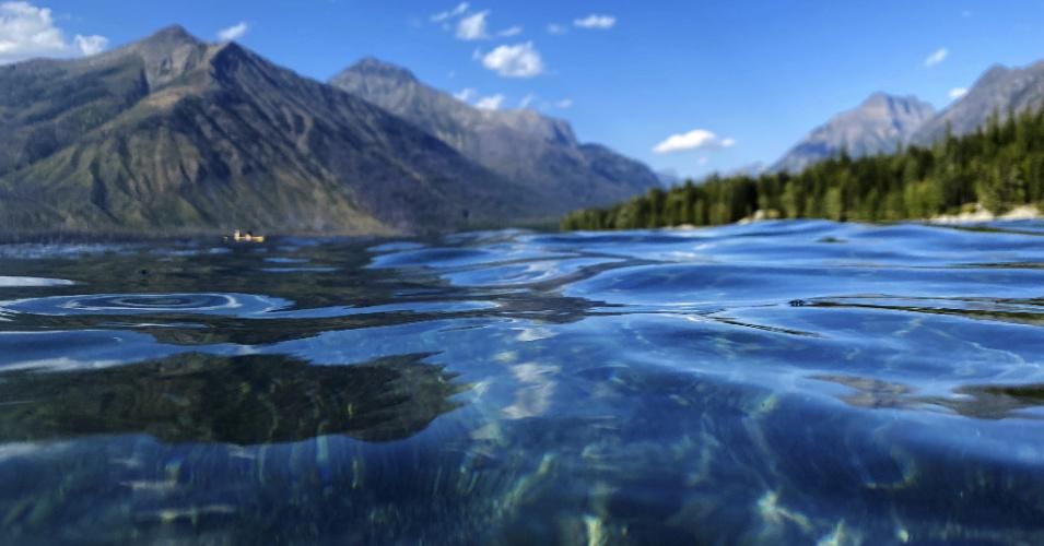 A water-level view in Glacier National Park, Montana. Regenerative Agriculture, explains Roulac, describes "farming and grazing practices that reverse climate change by rebuilding soil organic matter and restoring degraded soil biodiversity—resulting in both carbon drawdown and an improved water cycle." (Photo: Cavan Images/via Getty Images)