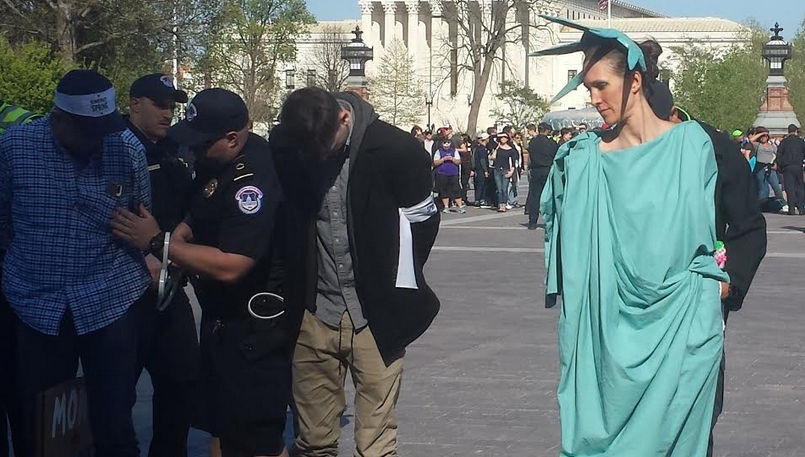 Lady Liberty getting arrested. "Being 'good'—kind and honest with those we touch directly—is admirable and desirable, but we need more," writes the author. "It's time to elevate another virtue: courage." (Democracy Spring - April 2016)