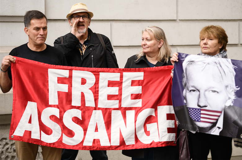 The US government has been waging a war against the First Amendment. Assange has become a political prisoner of this war. (Photo by Leon Neal/Getty Images)