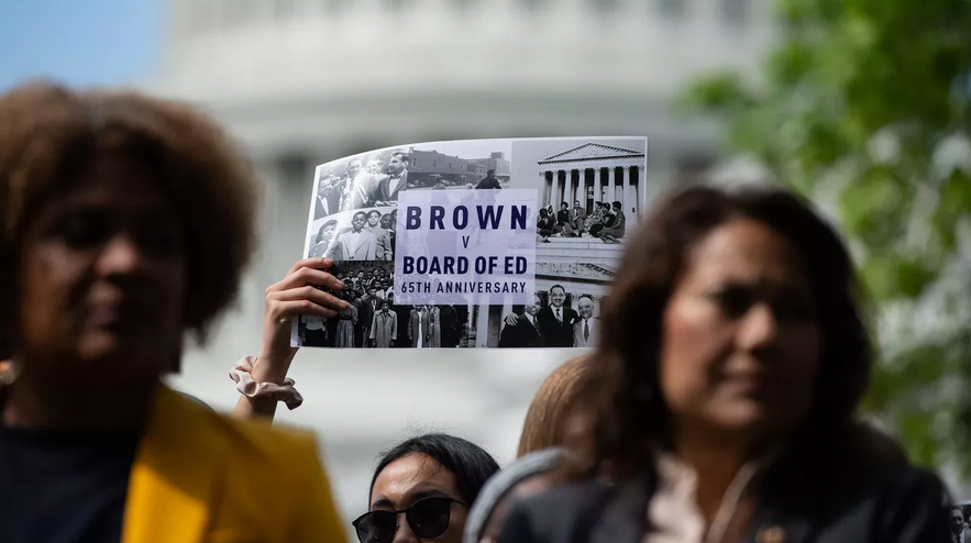 Near the Capitol in Washington, people attend a rally in 2019 to mark the 65th anniversary of the Brown v. Board of Education ruling that ended public school segregation and fueled the civil rights movement. (Photo:Nicholas Kamm/AFP via Getty Images)