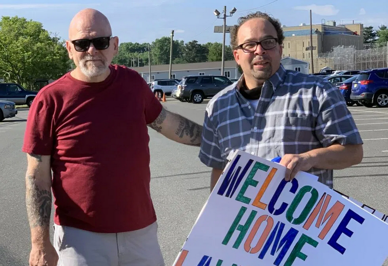 Lawrence Bell (right), moments after being released from East Jersey State Prison on Sunday, is greeted by his friend Ron Pierce [left], who was also incarcerated for three decades.
