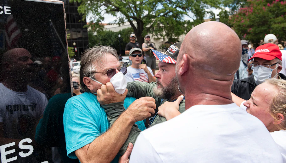 Paul Benson, attending a rally for Democratic candidate Hank Gilbert in Tyler, Tex., is attacked by Blue Lives Matter protesters on July 26. Benson says he was trying to keep counter-protesters back from the speakers when he was attacked. "I didn't expect this," Benson said, "I didn't know what to expect, but I didn't expect this." (Photo: Sarah A. Miller/AP)