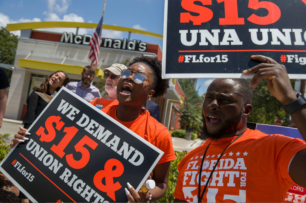 People gather together to ask the McDonald’s corporation to raise workers wages to a $15 minimum wage as well as demanding the right to a union on May 23, 2019 in Fort Lauderdale, Florida. (Photo by Joe Raedle/Getty Images)