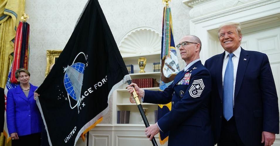 President Donald Trump is presented with the U.S. Space Force flag on May 15, 2020. (PhotoL Mandel Ngan/AFP/Getty Images)