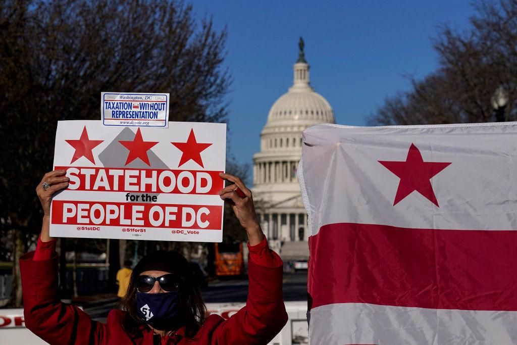Residents of the District of Columbia rally for statehood near the U.S. Capitol on March 22, 2021 in Washington, DC. On Monday, the House Oversight Committee is holding a hearing on legislation that the House passed last Summer that would establish the District of Columbia as the 51st state. The District has a population of nearly 700,000 residents. (Photo by Drew Angerer/Getty Images)