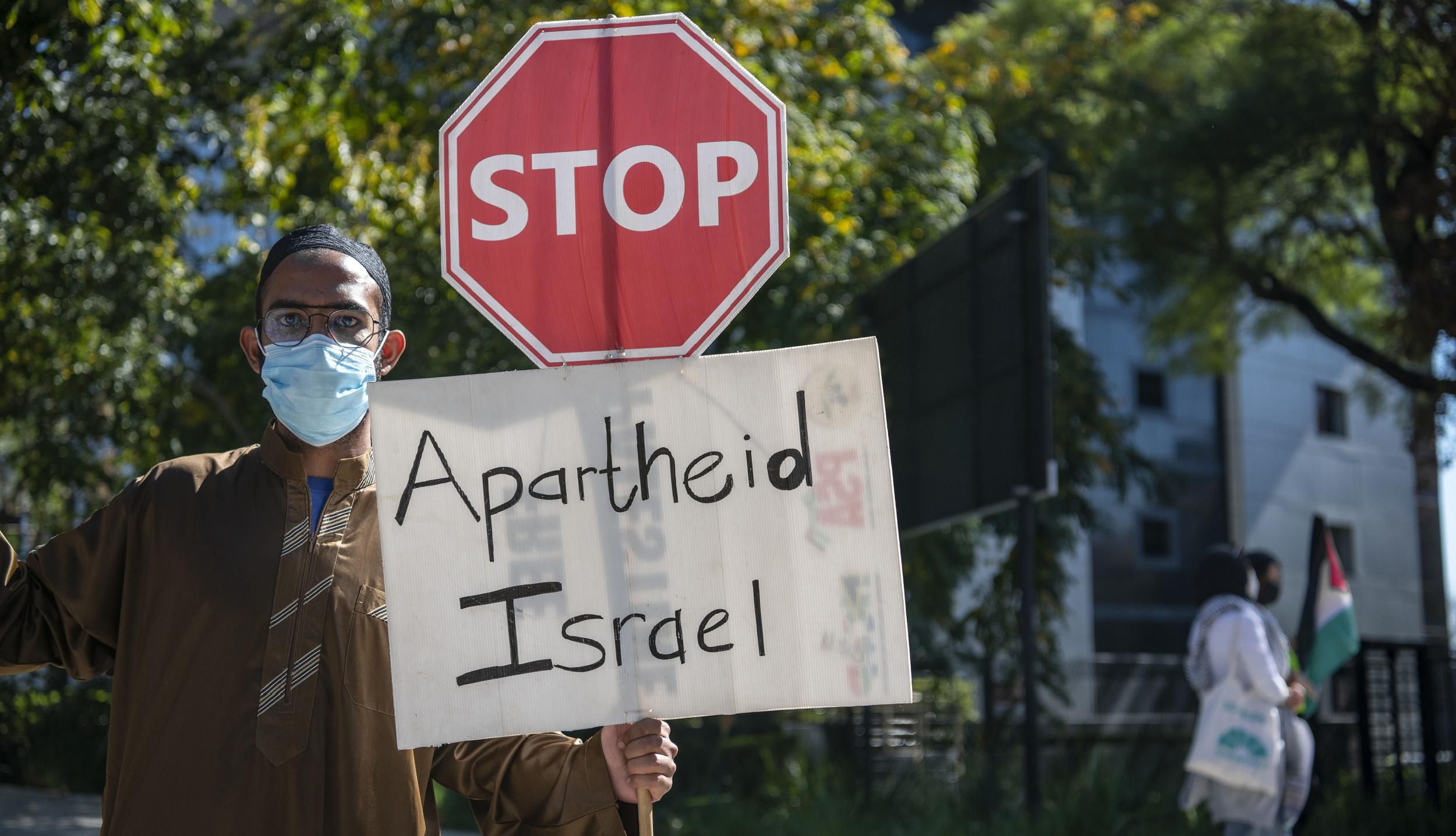 A group of South Africans hold banners during a demonstration to protest Israeli attacks on Palestinians at Masjid al-Aqsa in Jerusalem and Gaza Strip, on May 11, 2021, in Sandton district of Johannesburg, South Africa. (Photo: Ihsaan Haffejee/Anadolu Agency via Getty Images)