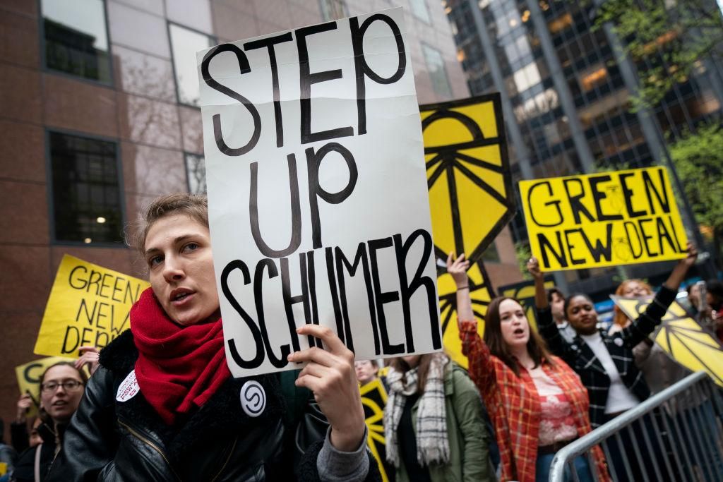 Activists rally in support of proposed 'Green New Deal' legislation outside of Senate Minority Leader Chuck Schumer's (D-NY) New York City office, April 30, 2019 in New York City. The activists called on Minority Leader Schumer (D-NY) to support the 'Green New Deal' legislation in Congress. (Photo by Drew Angerer/Getty Images)