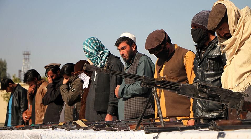 Taliban fighters attend a surrender ceremony in Jalalabad city, capital of Nangarhar province, Afghanistan, Feb. 8, 2020.