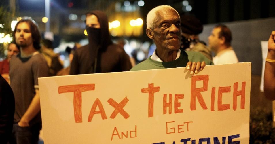 Demonstrator Randall Grey protests a taxation of the wealthy during a rally at Occupy Wall Street San Diego on Thursday, October 13, 2011 in San Diego, California. (Photo: Sandy Huffaker/Corbis via Getty Images)