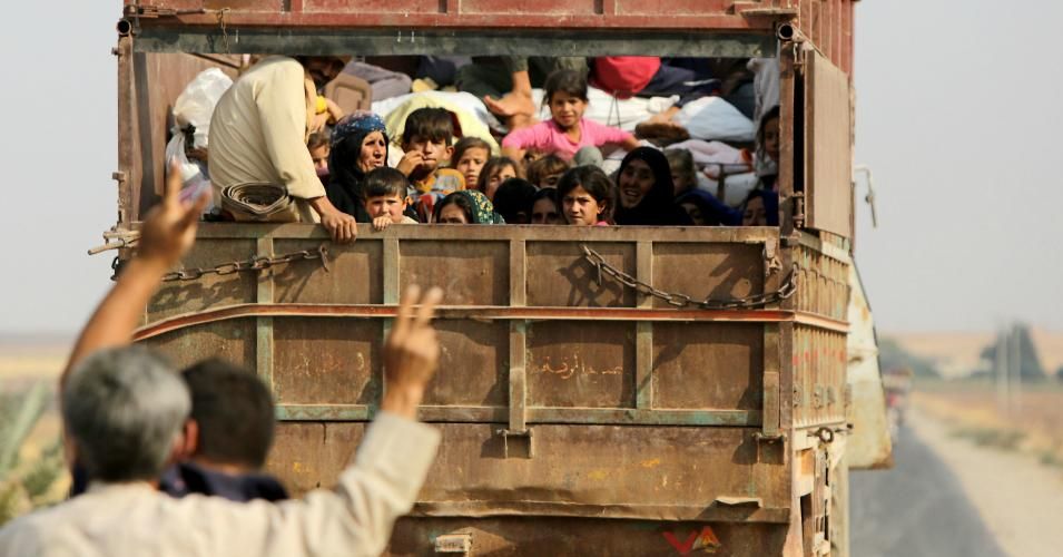 Kurdish Syrian civilians flee the town of Kobane on the Turkish border on October 16, 2019 as Turkey and its allies continue their assault on Kurdish-held border towns in northeastern Syria. - Turkey rebuffed international pressure to curb its military offensive against Kurdish militants in Syria today as US President Donald Trump dispatched his deputy Mike Pence to Ankara to demand a ceasefire. (Photo: Bakr Alkasem/AFP via Getty Images)