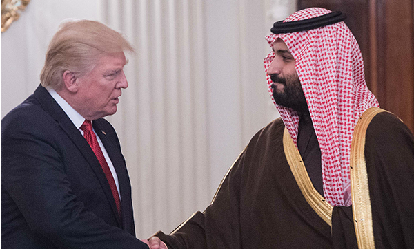 U.S. President Donald Trump and Saudi Deputy Crown Prince and Defense Minister Mohammed bin Salman shake hands in the State Dining Room before lunch at the White House in Washington, D.C., on March 14, 2017. 