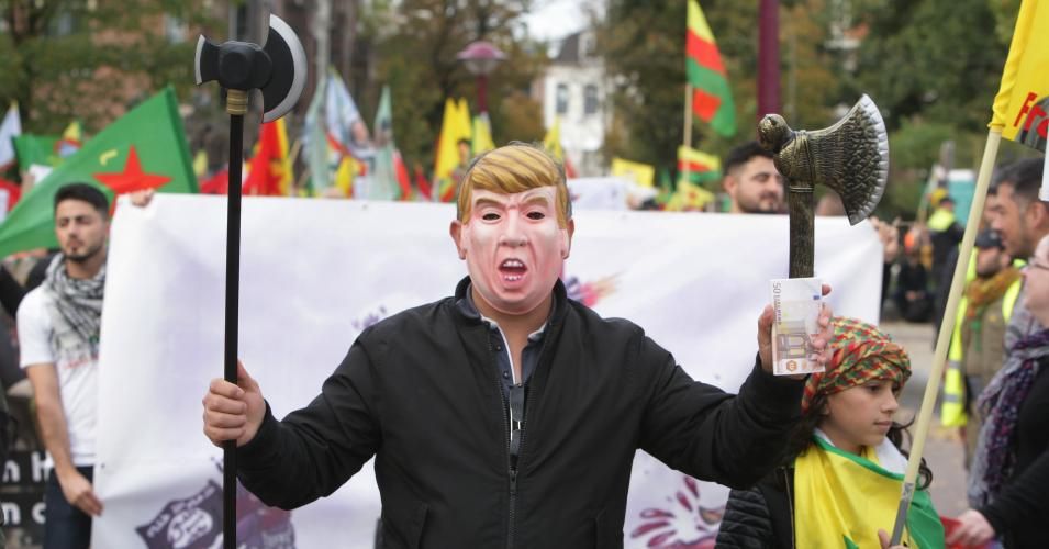 Kurdish activists wears a mask of the American president Donald Trump during demonstration against the ongoing Turkish military operation in the northeastern Syria on October 19,2019 in Amsterdam, Netherlands. Dutch Kurdish community demonstrated in the streets of Amsterdam to protest against the offensive launched by the army of Turkey in the region of Rovaja, Syrian Kurdistan region, the last bulwark against Daesh. (Photo: Paulo Amorim/NurPhoto via Getty Images)