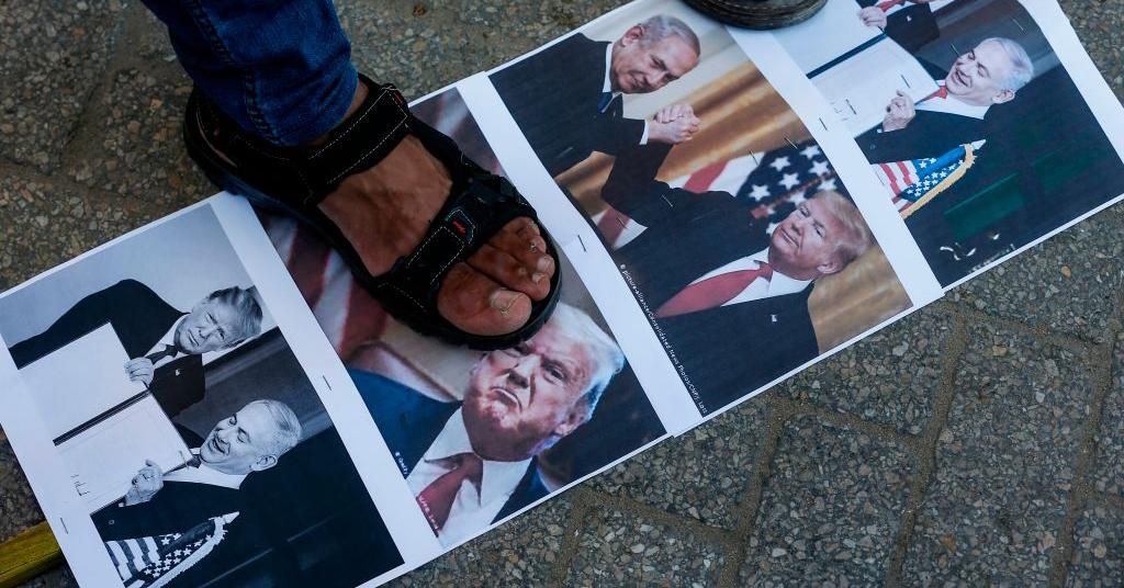 Palestinian demonstrators burn pictures of US President Donald Trump and Israeli Prime Minister Benjamin Netanyahu during a protest against a US-brokered deal between Israel and the UAE to normalize relations, in the northern Gaza Strip refugee camp of Jabalia, on August 15, 2020. (Photo: Mahmud Hams/AFP via Getty Images)