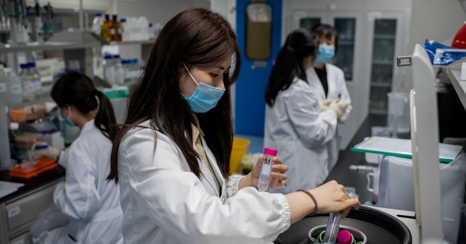 In this picture taken on April 29, 2020, engineers work on an experimental vaccine for the Covid-19 coronavirus at the Quality Control Laboratory at the Sinovac Biotech facilities in Beijing.