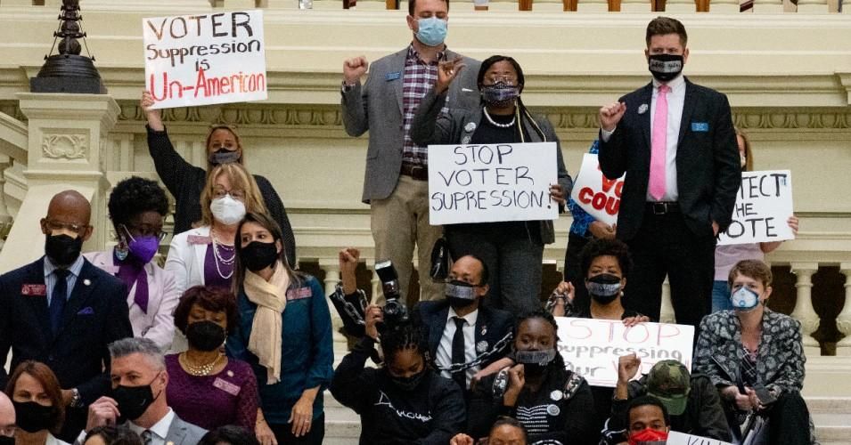 Demonstrators hold a sit-in inside of the Georgia state Capitol building in opposition to a voter suppression bill on March 8, 2021 in Atlanta. (Photo: Megan Varner/Getty Images)