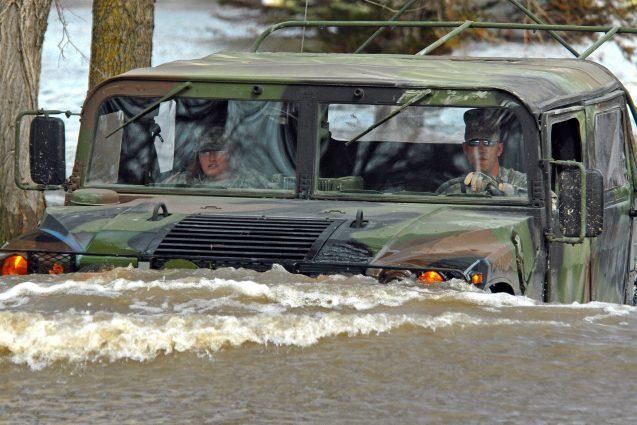 U.S. Army personnel drive through flood waters in Fort Ransom, ND. (Photo: US Army)