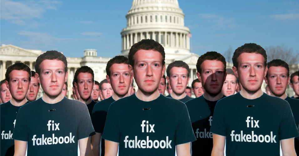One hundred cardboard cutouts of Facebook founder and CEO Mark Zuckerberg stand outside the US Capitol in Washington, DC, April 10, 2018. - Advocacy group Avaaz is calling attention to what the groups says are hundreds of millions of fake accounts still spreading disinformation on Facebook. (Photo: Saul Loeb/AFP/Getty Images)
