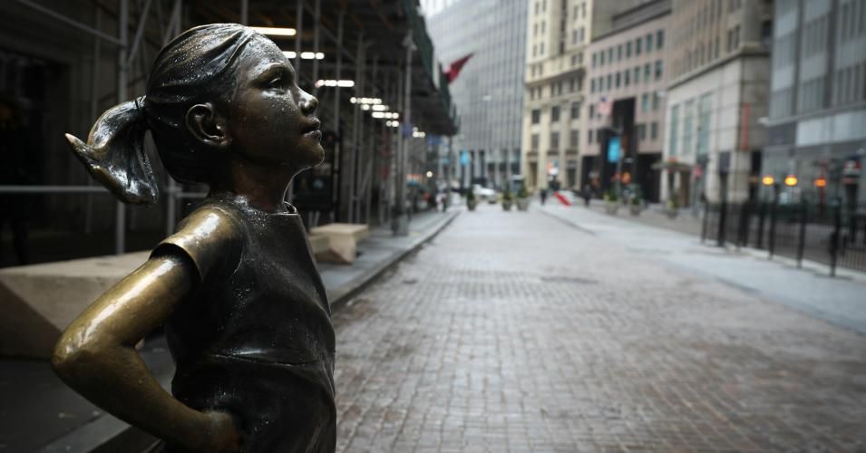Fearless Girl Statue by the New York Stock Exchange building is seen at the Financial District in New York City, United States on March 29, 2020. New York is ranked as one of the largest International Financial Centres ("IFC") in the world, now seen so quiet due the Covid-19 pandemic. (Photo: Tayfun Coskun/Anadolu Agency via Getty Images)