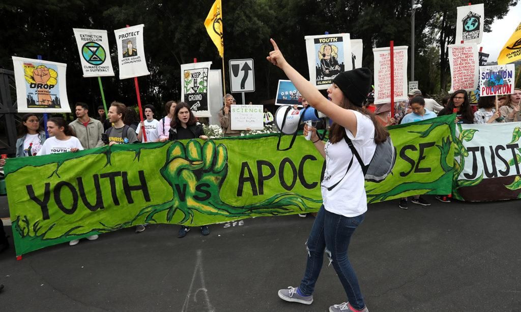 Youth climate activists hold signs during a Climate Strike youth protest outside of Chevron headquarters on Sept. 27, 2019, in San Ramon, California. Hundreds of activists and their supporters were calling for the company to abandon fossil fuels by 2025. (PHOTO BY JUSTIN SULLIVAN/GETTY IMAGES)