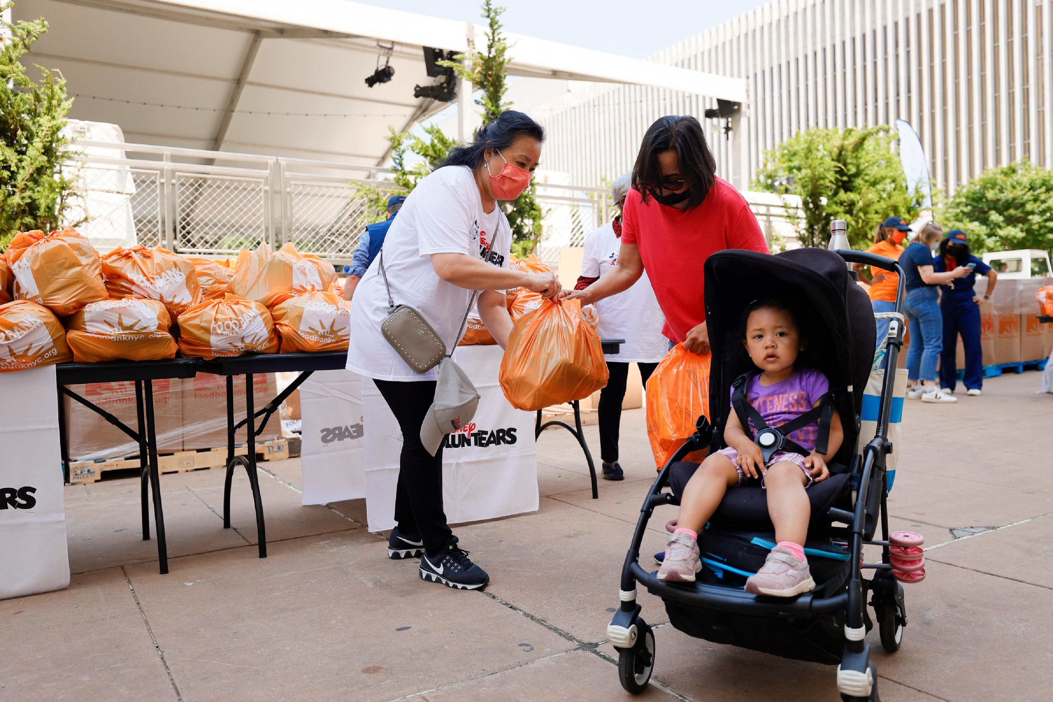 New Yorkers receive food at a food distribution event