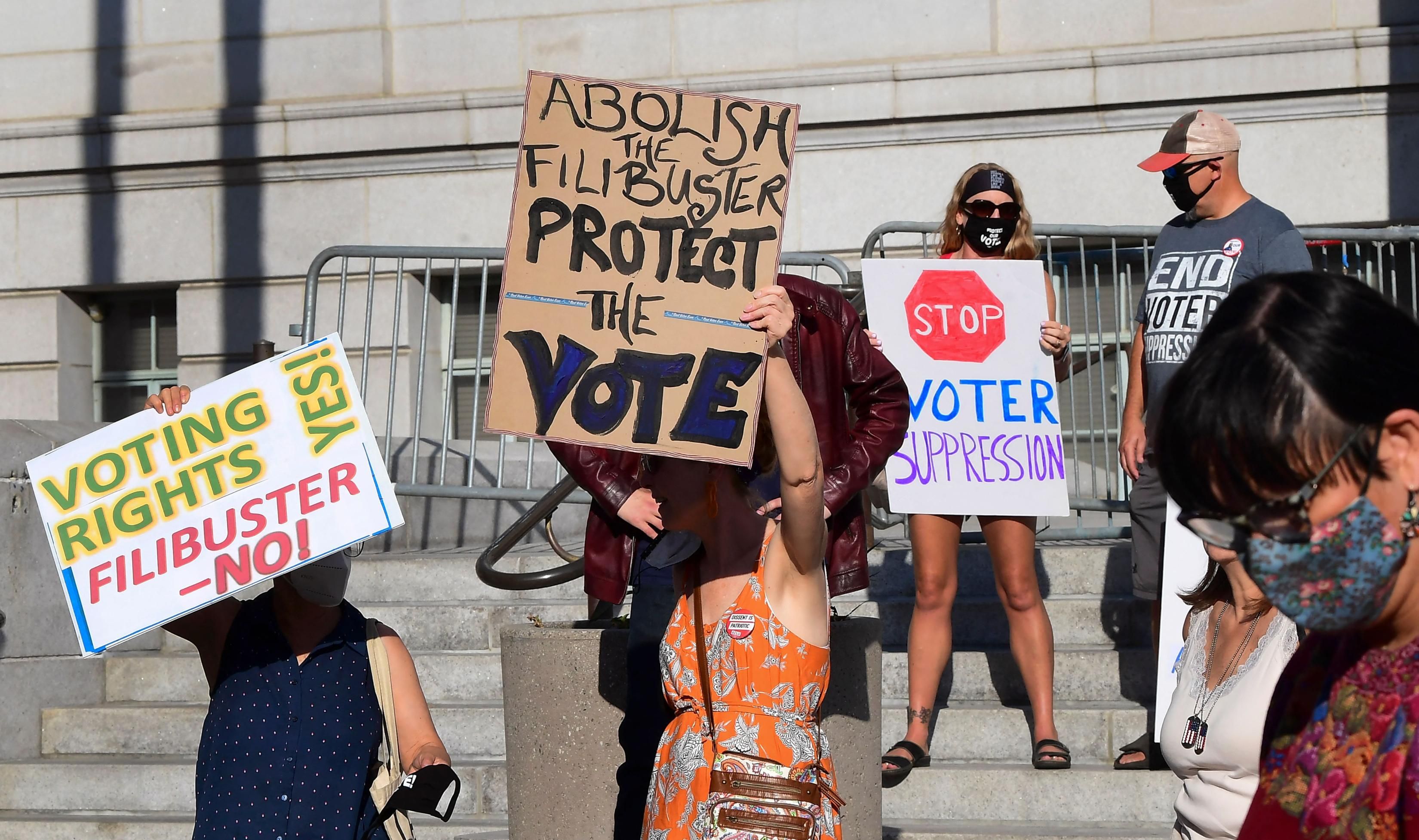 Activists from various grassroots organizations rally outside City Hall in Los Angeles on July 7, 2021, calling on Sen.&nbsp;Dianne Feinstein (D-Calif.) and other senators&nbsp;to remove the filibuster and pass the "For the People Act" to expand voting rights. (Photo: Frederic J. Brown/AFP via Getty Images)