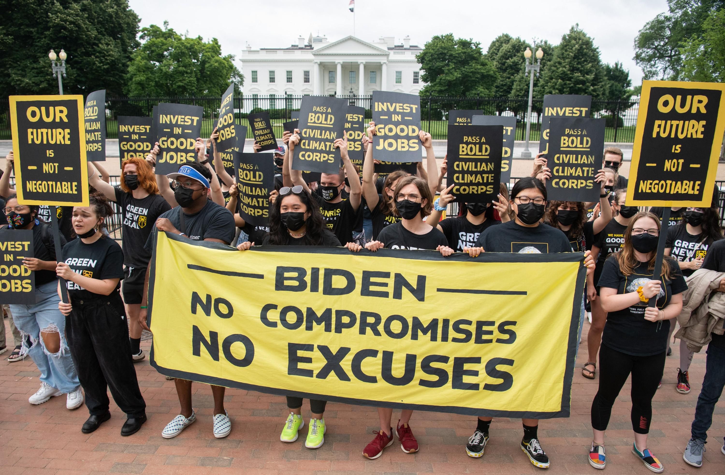 Activists with the Sunrise Movement protest in front of the White House