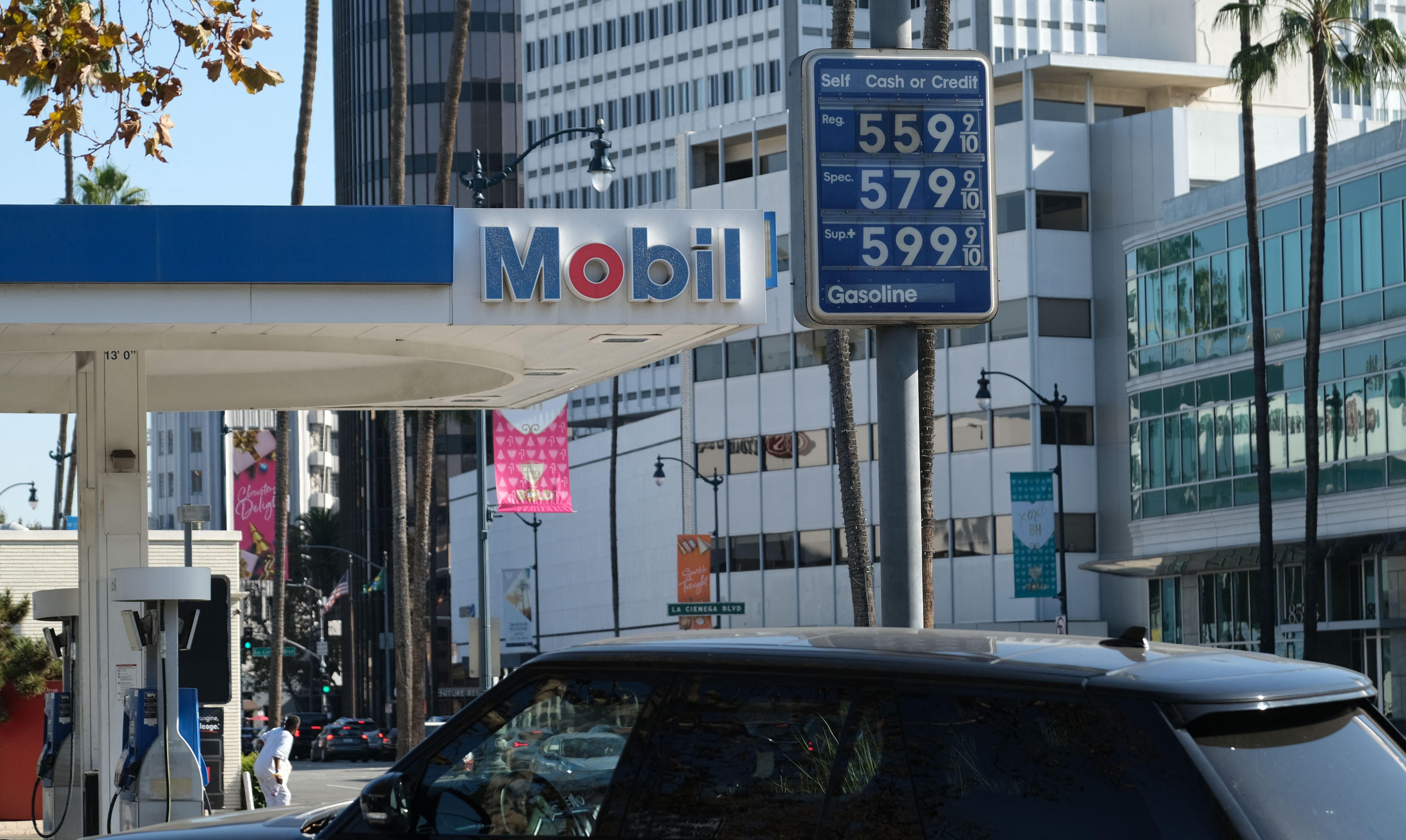 The high price of gasoline is displayed at a Los Angeles gas station on November 24, 2021