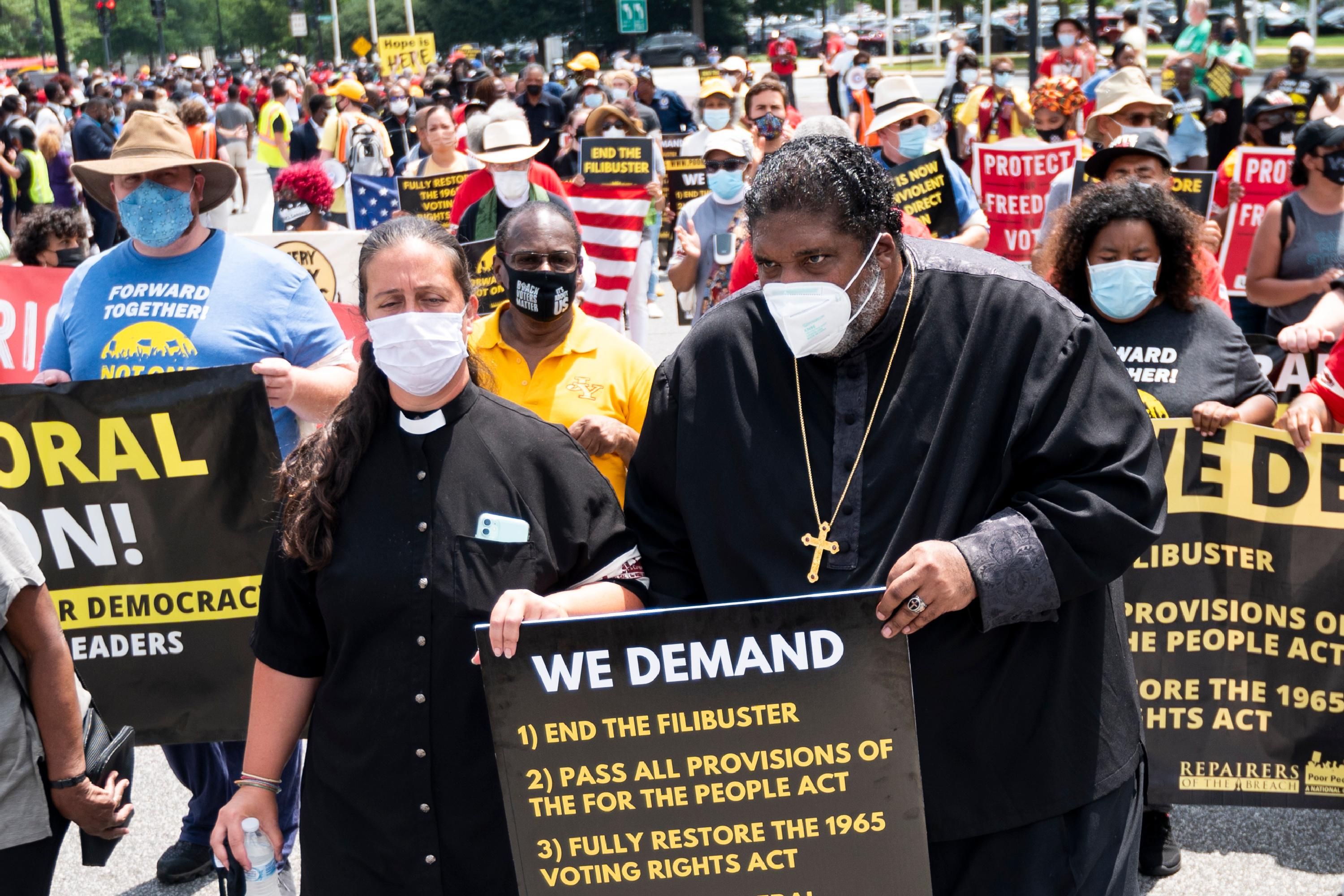 Rev. Dr. William J. Barber and Rev. Dr. Liz Theoharis lead a march in Washington, D.C.