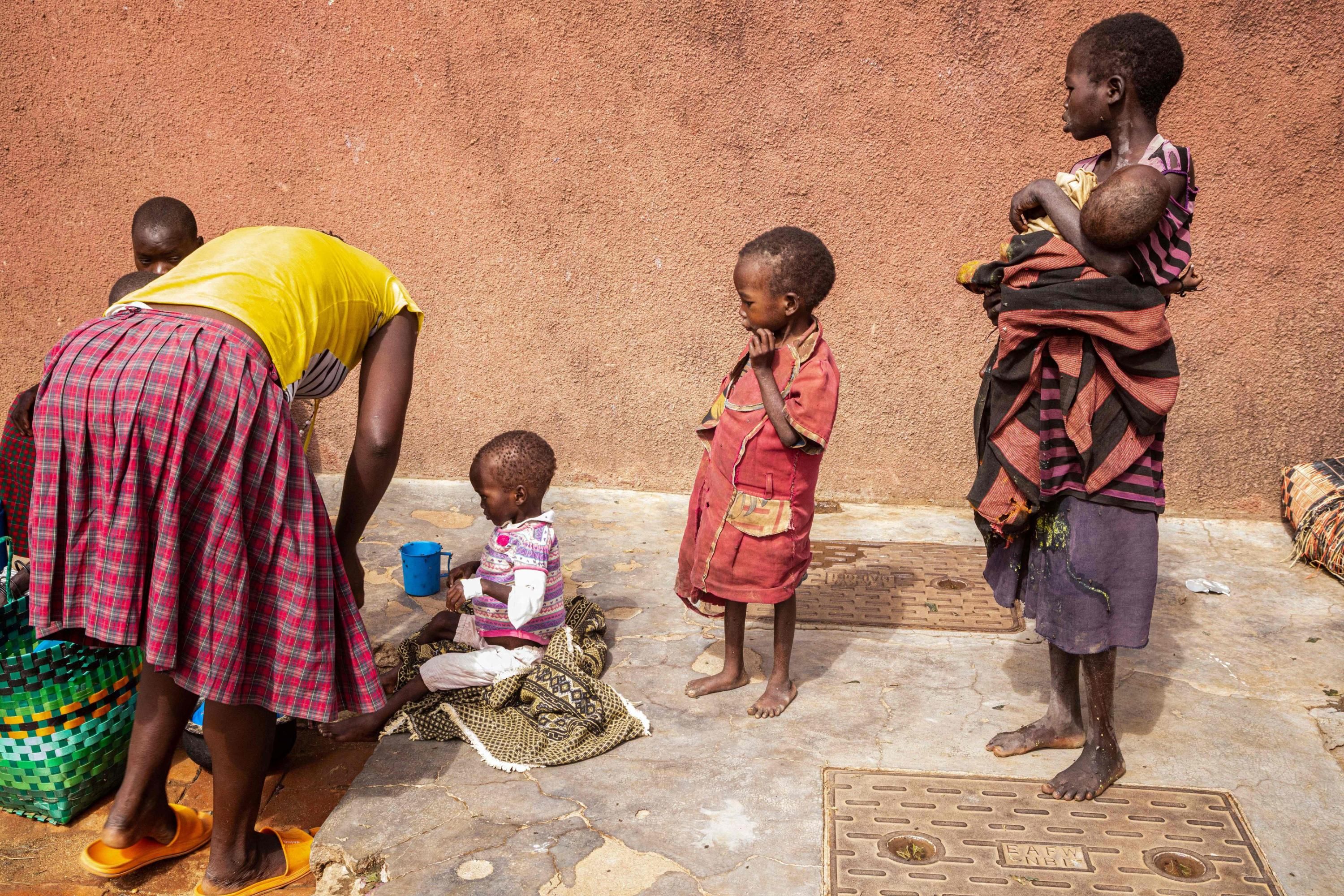 Mothers stay with malnourished children in Uganda