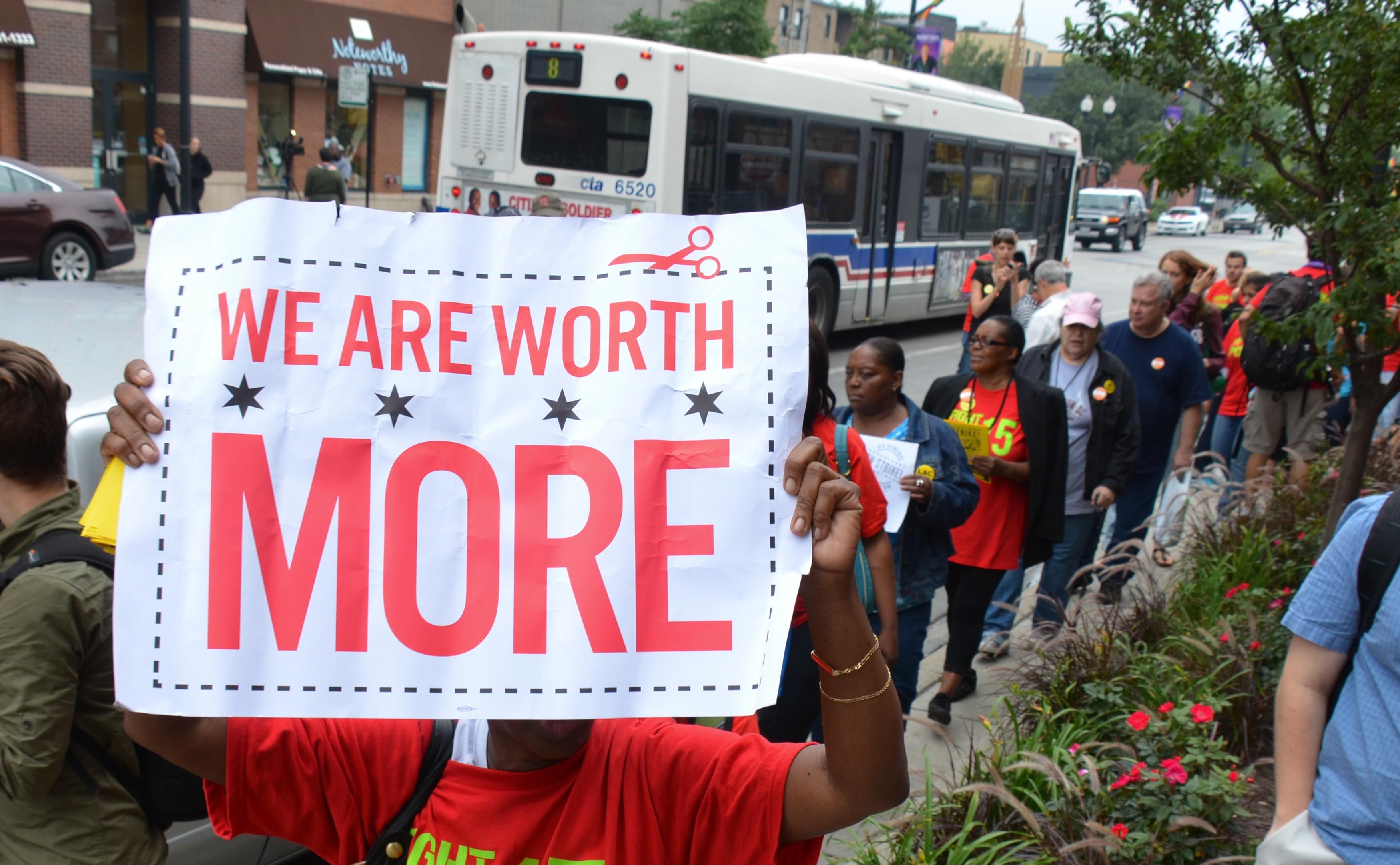 Activists march for a higher minimum wage