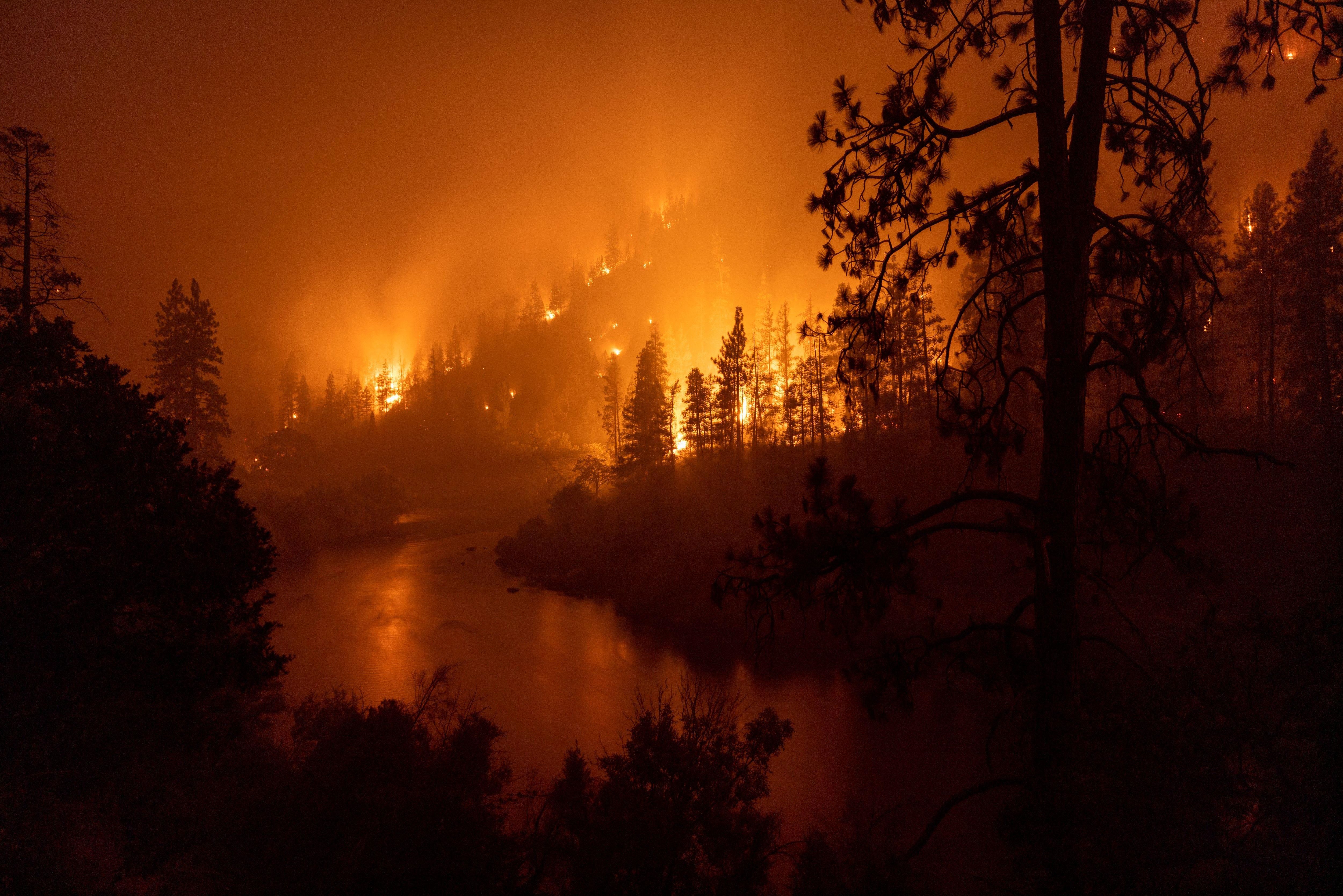 Flames burn during the McKinney Fire in the Klamath National Forest northwest of Yreka, California, on July 31, 2022.