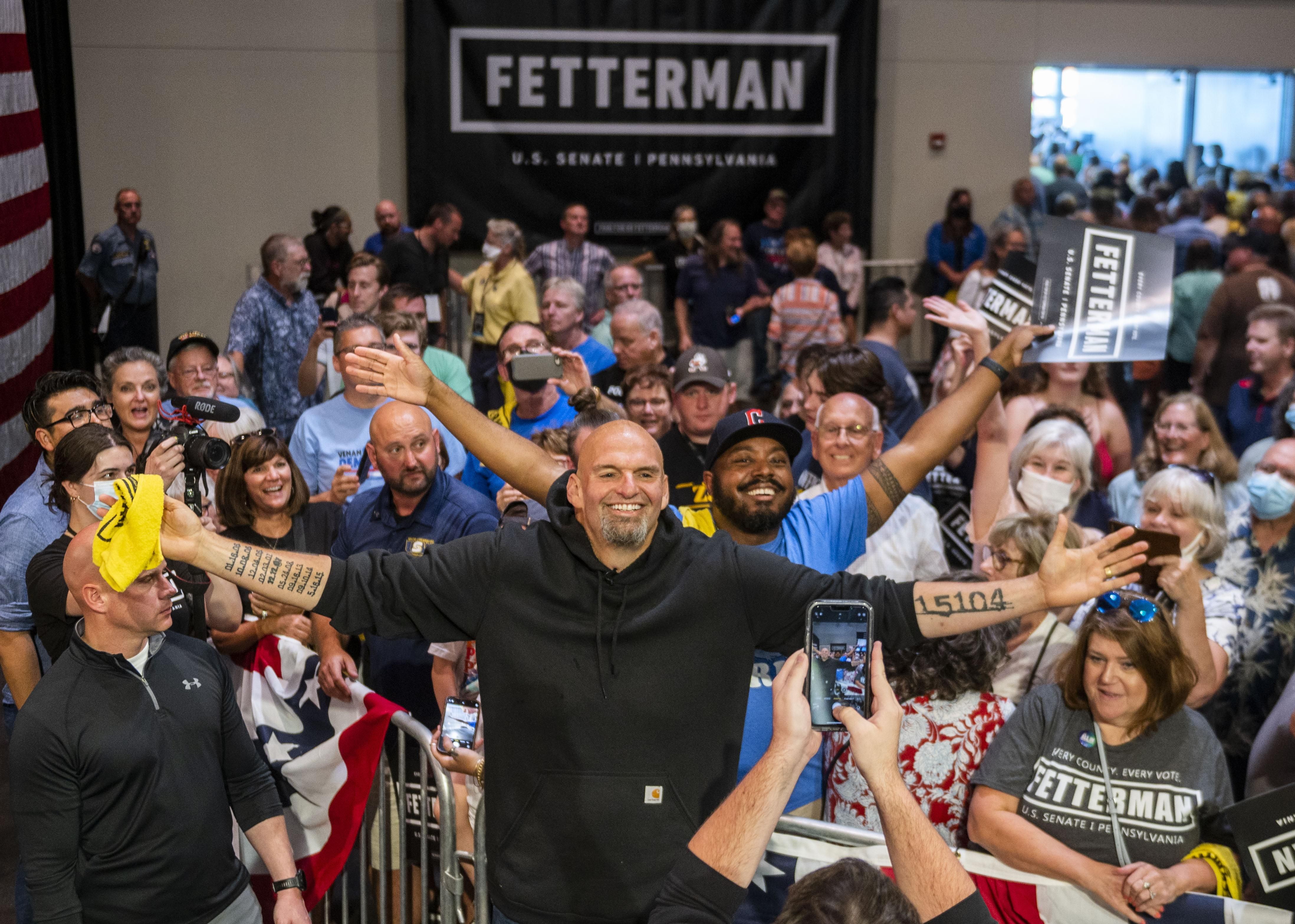 Pennsylvania Lt. Gov. John Fetterman, the Democratic nominee for the state's open U.S. Senate seat, takes photos with supporters following a rally at the Bayfront Convention Center on August 12, 2022 in Erie.