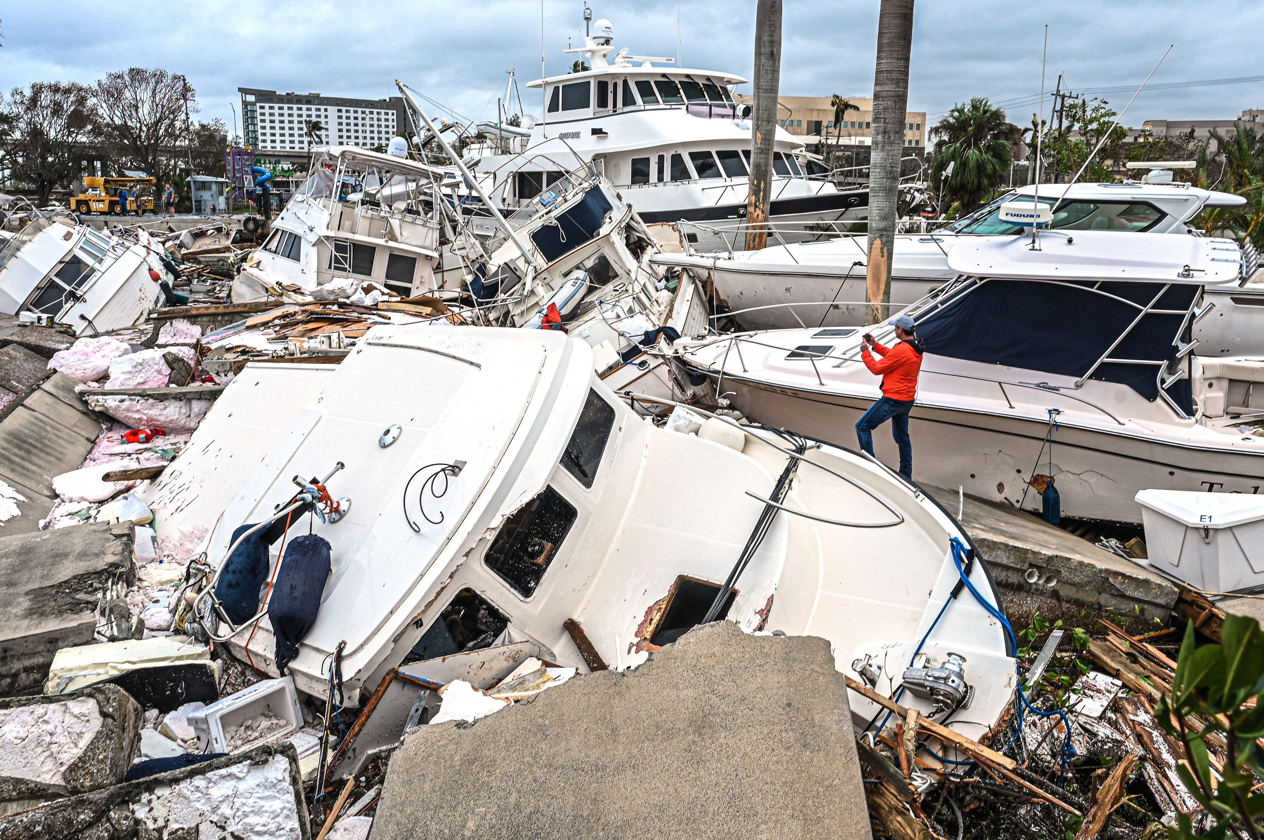 Damaged boats in a pile following Hurricane Ian
