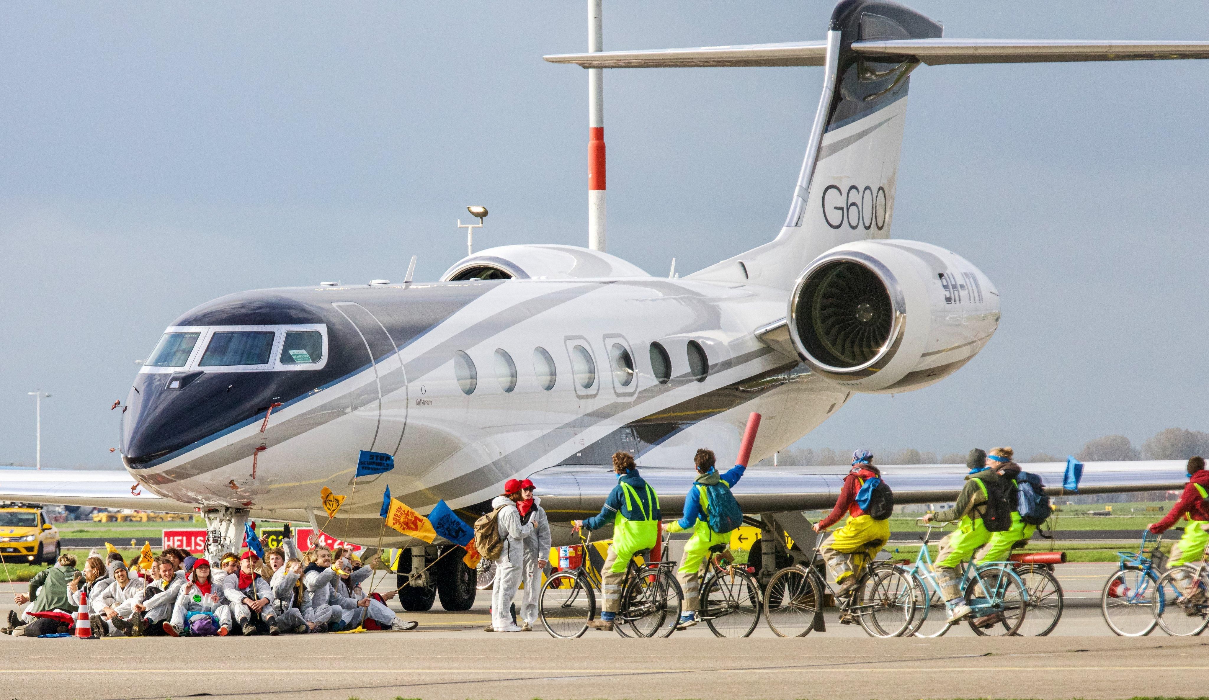 Greenpeace activists block private jet in Amsterdam