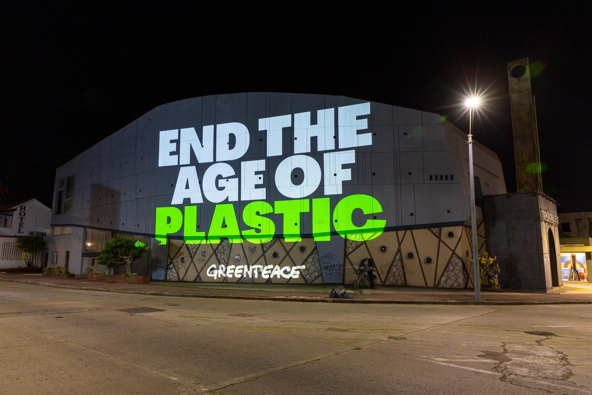 Greenpeace projects messages as world leaders discuss a Global Plastics Treaty in Punta del Este, Uruguay on November 29, 2022.