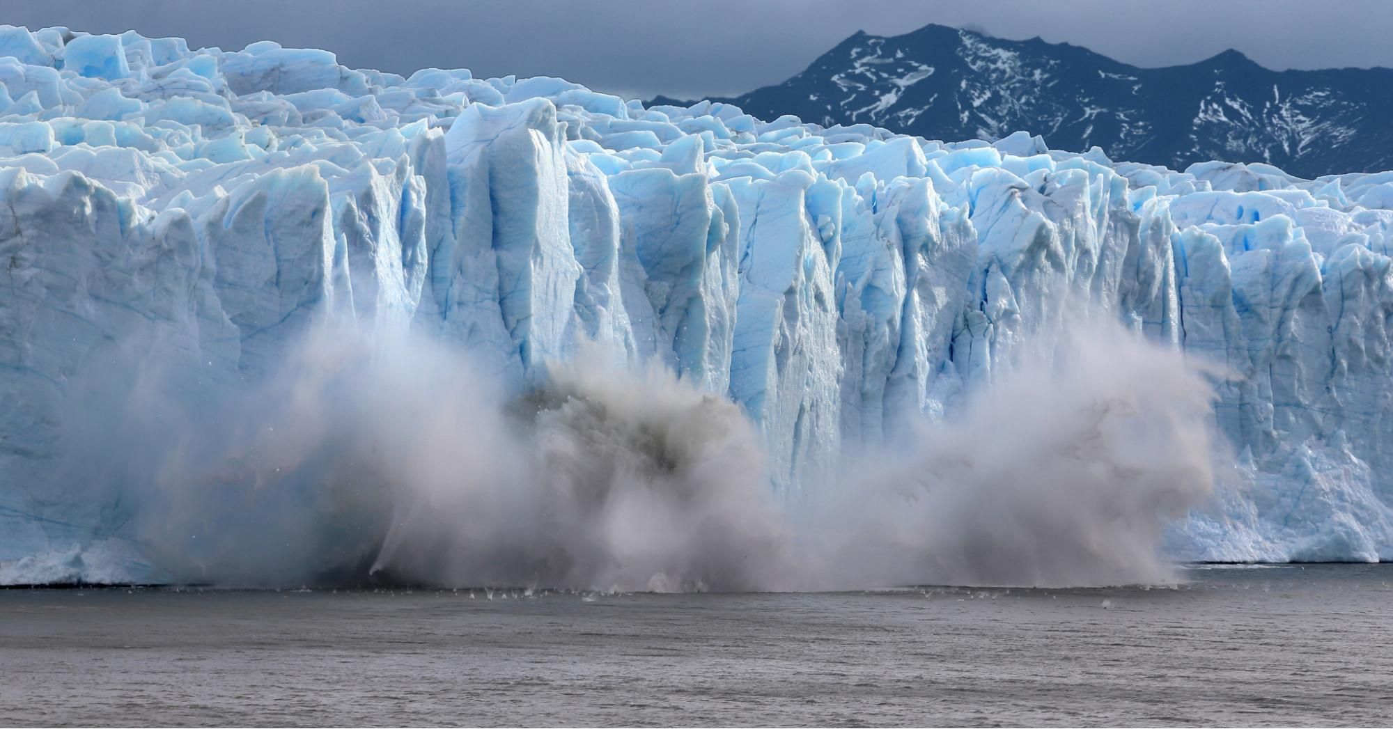 A piece of the Perito Moreno glacier, part of the Southern Patagonian Ice Field, breaks off and crashes into Lake Argentina in the Los Glaciares National Park on April 5, 2019 in Santa Cruz province, Argentina. (Photo: David Silverman via Getty Images)